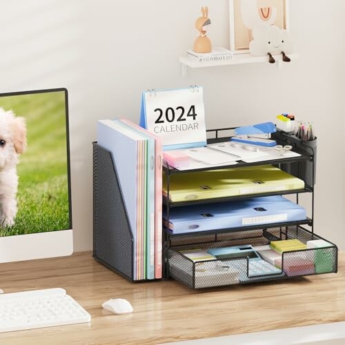 Desktop organizer with calendar, folders, and stationery on a wooden desk.