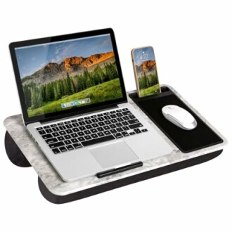 Laptop and phone on a portable lap desk with mouse pad.