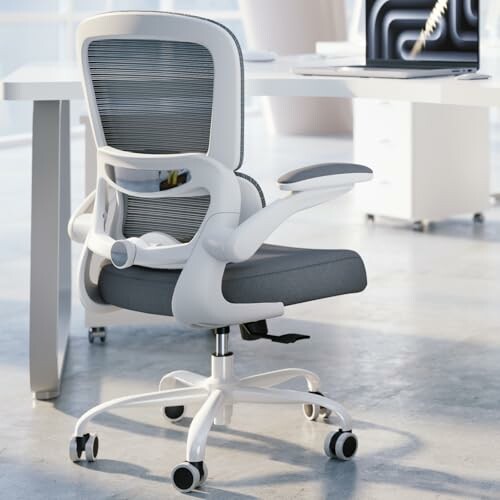 Ergonomic office chair with mesh backrest at a desk.