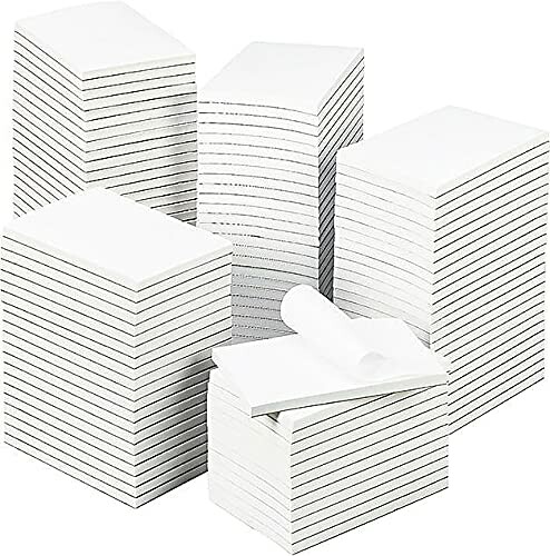 Stacks of white paper pads in various sizes.